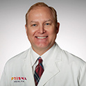 Headshot of Dr. John Absher in a white lab coat.