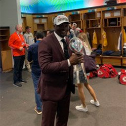 Coach Rod Wilson Coach Rod Wilson holding Super Bowl trophy