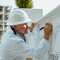 Dean Harmon signing the top-out beam