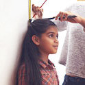 Child's height being measured